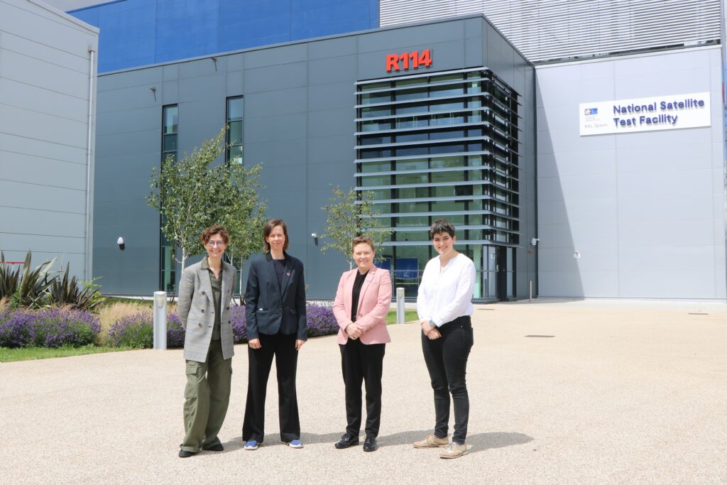 Left to Right: Professor Giovanni Tinetti (Ariel Principal investigator), Dr Rachel Drummond (Ariel project manager), Dr Sarah Beardsley (Director, RAL Space), and Dr Charly Knight (Principal Test Engineer, RAL Space) stand outside the new National Satellite Test Facility. Credit: STFC RAL Space.
